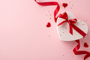 Perfect female occasion concept: Snapshot from top view of modish heart-shaped package, decor, and shimmer on a blush pink canvas, with a vacant area for text or advertisements