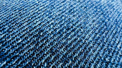 Macro texture of denim wallpaper. Close-up view of jeans. Blue cotton textured fabric background. Soft focus. film grain pixel texture. Defocused.