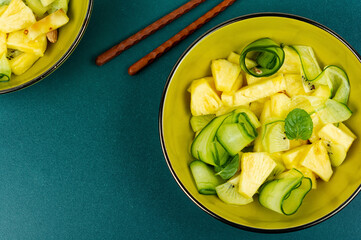Fresh exotic vegan salad with pineapple.