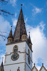 Fototapeta na wymiar church tower with clock in sibiu big square
