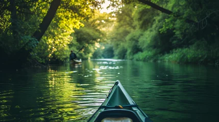 Foto op Canvas A peaceful kayaking journey along a serene river surrounded by lush greenery. © Melvin