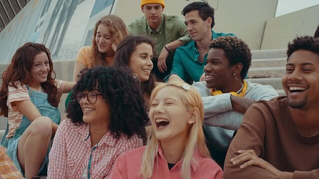 Multiethnic group of teenagers hanging out in the city center. Concepts about campus university students, friendship, and generation z