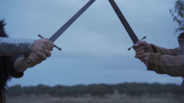 
Medieval soldiers fight with swords in slow motion