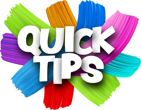 Quick tips paper word sign with colorful spectrum paint brush strokes over white.