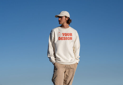 Mockup of man wearing customized sweatshirt, blue sky