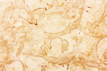 Parchment paper background. Coffee stains background. Brown splash texture. Burned letter...