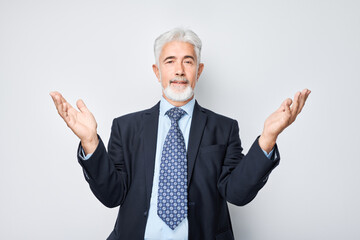 Portrait gray-haired man happy face smiling joyfully with raised palms and shocked open mouth isolated on white studio background.