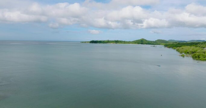 Tropical island with turquoise sea in coastal area in Looc, Tablas Island. Romblon, Philippines.