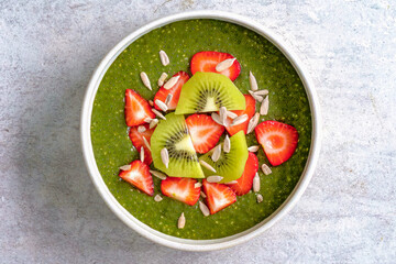 Chia pudding, plant based breakfast, healthy vegetarian food. Vegan superfood with chia, sliced fruits. Mixed vegetarian meal for restaurant, menu, advert, package, close up, selective focus. Top view