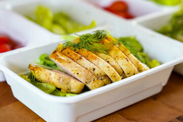 Healthy balanced diet delicious lunch box with vegetables, chicken. Homemade take away box with chicken for deliver ready meal, advert or package, close up selective focus