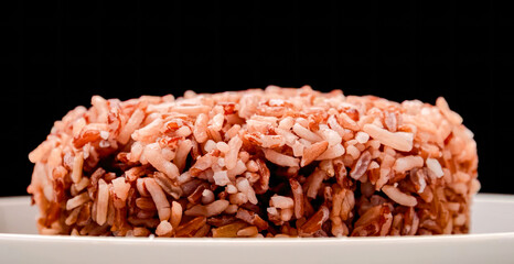 Brown rice made by boiling whole grain. Healthy balanced meal, homemade cooking brown rice close up, selective focus - obrazy, fototapety, plakaty