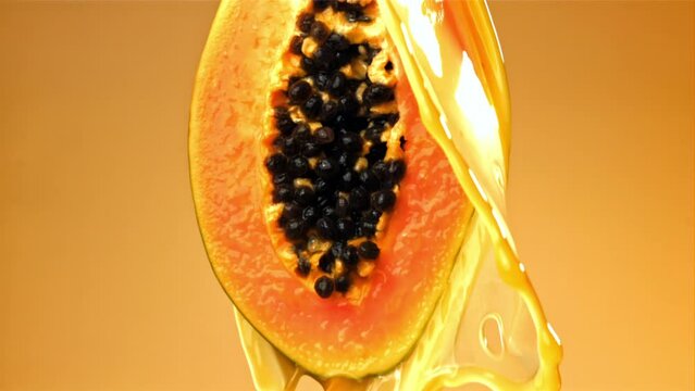 Fresh papaya with a splash of juice. Filmed on a high-speed camera at 1000 fps. High quality FullHD footage