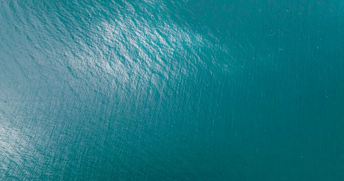 Top view of deep blue sea and waves with sun reflection in San Jose, Romblon. Philippines. Seascape.