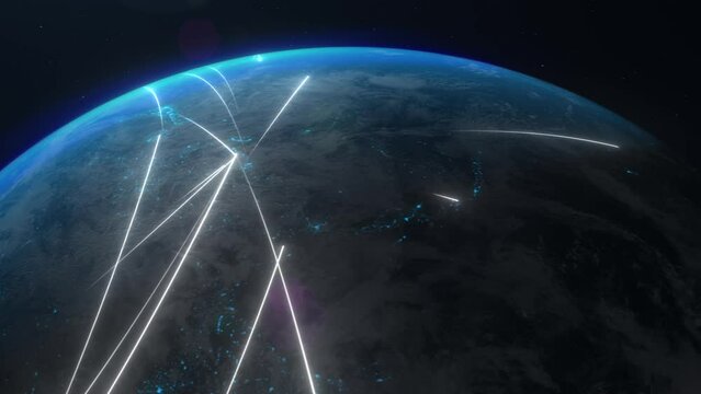A satellite view of the world, with white lines indicating flows of information transfers, travel or business directions across the globe. The interconnectedness, complexity, communication.