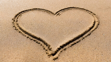 Romantic heart drawn in sand for Valentine's Day
