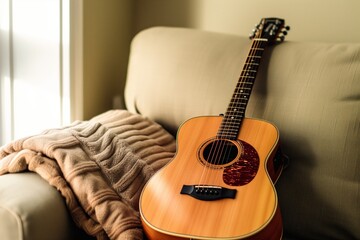 couch rest, acoustic guitar resting against the sofa