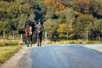 Girl rider goes riding with her horse ready to ride.