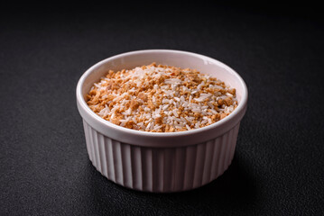Large grains of uncooked white rice in a ceramic bowl