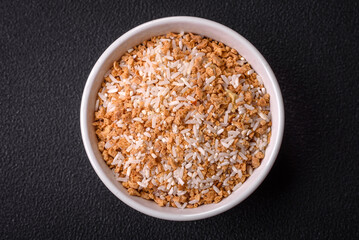 Large grains of uncooked white rice in a ceramic bowl