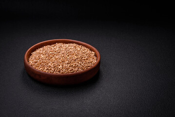 Large grains of wheat porridge are brown in color when raw