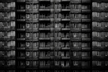 Dark texture featuring windows and doors on a high rise building, symbolizing feelings of depression and hopelessness in life
