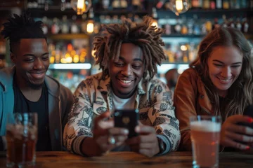 Fotobehang In the pub, a young man and his companions are on their phones. Generative Ai. © Imran