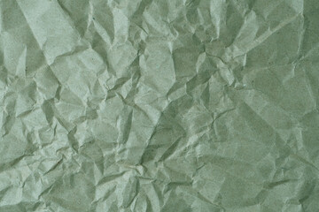 Crumpled green paper texture background