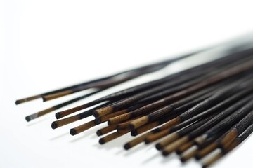 A detailed view of a collection of incense sticks. Perfect for creating a calming atmosphere.