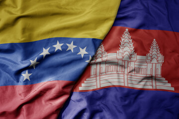 big waving national colorful flag of cambodia and national flag of venezuela . macro