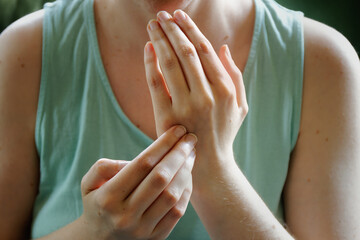 Person practicing EFT. Female tapping gamut point, hands close-up view. - obrazy, fototapety, plakaty