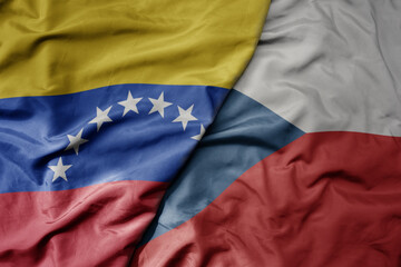 big waving national colorful flag of czech republic and national flag of venezuela . macro