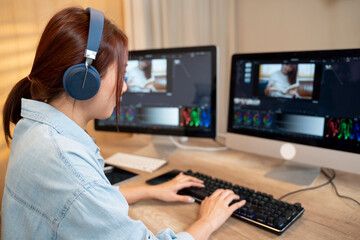 Female Video Editor Works with Footage and Sound on Her Personal Computer. - 726435068