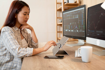 Side view businesswoman analyzing stock market investment with digital tablet. - 726436258