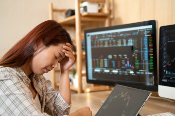 Woman stressed of business financial crisis and investing online trading in stock and cryptocurrency, decentralize and Stock market concept