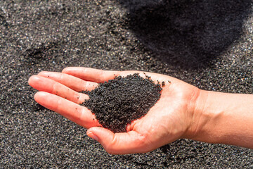 handful of black sand