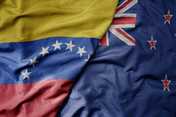 big waving national colorful flag of and national flag of venezuela . macro