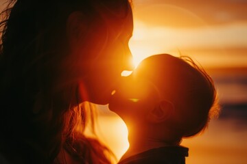 A touching moment captured as a woman and child share a loving kiss against the backdrop of a beautiful sunset.