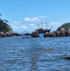Fototapeta premium Sea with blue sky and ship in the background