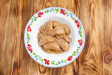 dumplings with meat on the wooden table