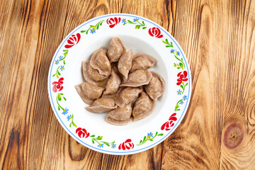 dumplings with meat on the wooden table