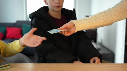 Aunt giving euro currency money to the niece and nephew. Domestic apartment in the background.