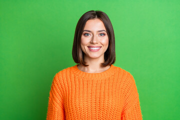 Photo of cheerful gorgeous girl toothy beaming smile good mood knitwear isolated on green color...