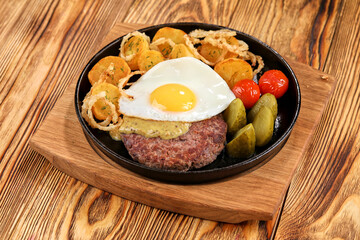 baked potatoes with cultet and fried egg