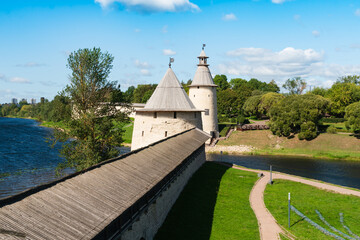 Pskov, Russia, September 6, 2023. The walls and towers of the Kremlin near the Velikaya River.