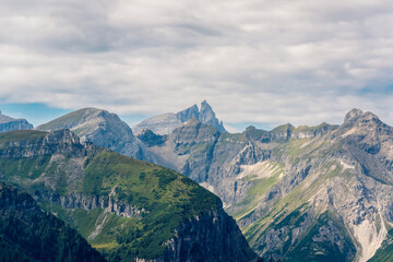 Naklejka premium Picturesque alpine landscape in summer. Stubai Alps on the border between Tyrol, Austria, and South Tyrol, Italy. View from Mount Blaser above the village of Trins.