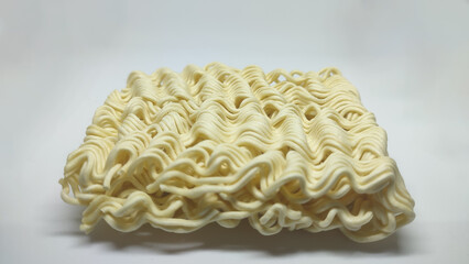 Raw instant noodles on a white background