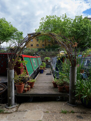 London - 29 05 2022: Lisson Grove shared dock between two moored houseboats.