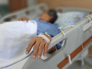 Elderly patient asian woman lying on bed in hospital