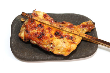 grilled chicken with bamboo sticks