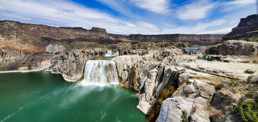 Shoshone Falls Reservoir in Twin Falls, Idaho. Wide angle view of the water flowing over the stone...
